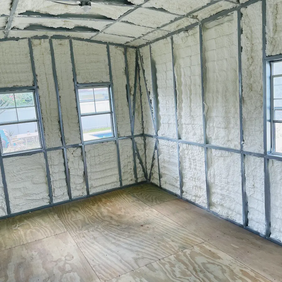 Closed-cell spray foam insulation applied to wall cavities in a residential project in Ilion